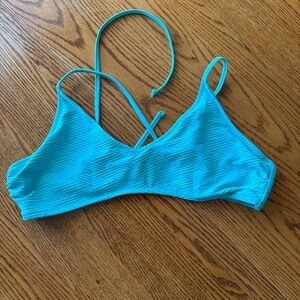 Straps trail swim top only.